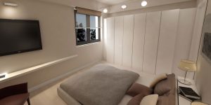 camera da letto con cabina armadio e televisione